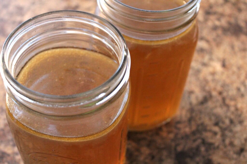 Close up picture of bone broth in mason jars