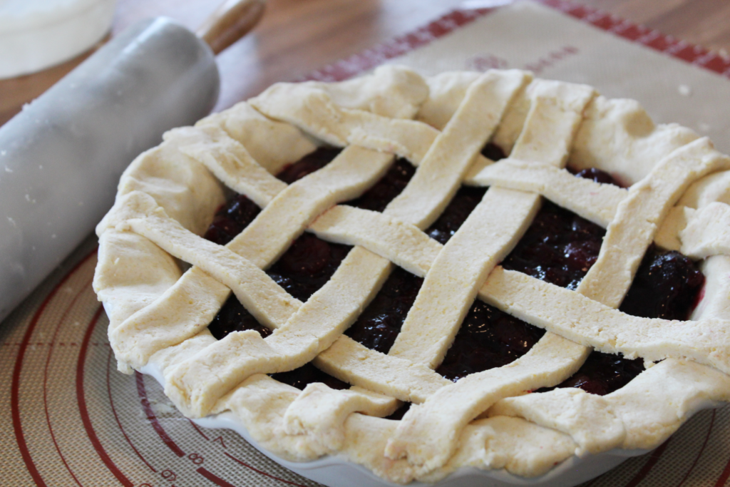 unbaked cherry pie with a woven crust