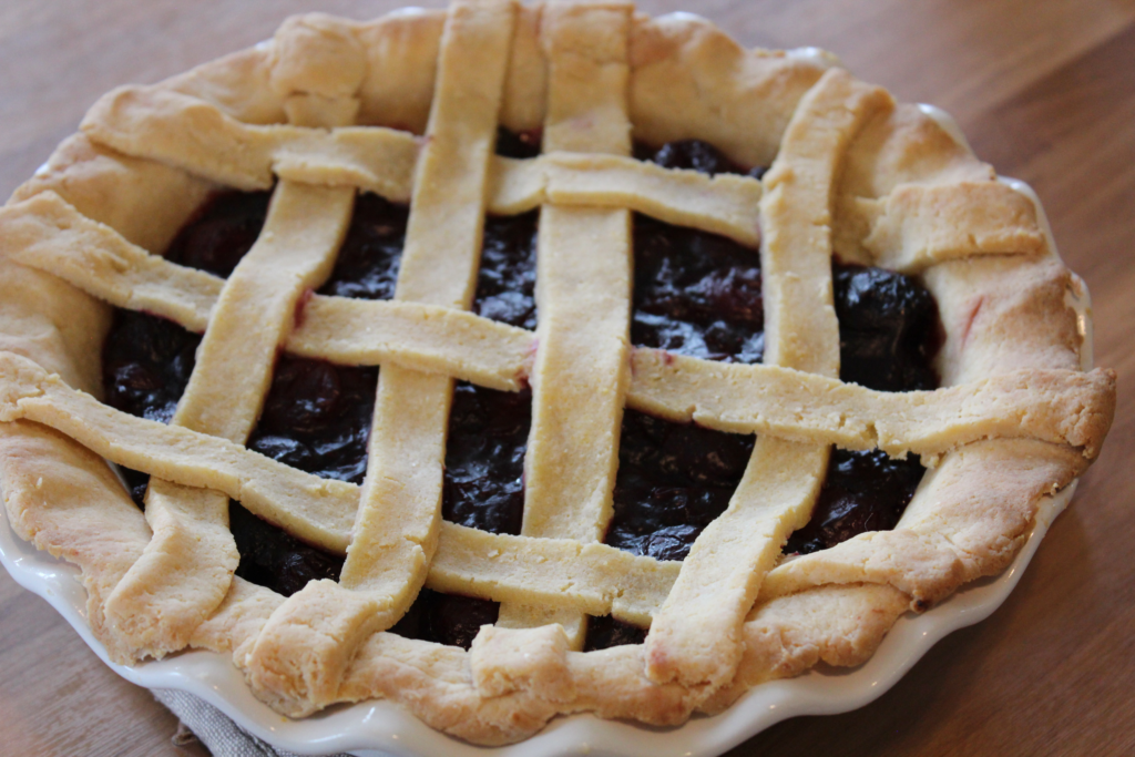 Close up of a baked cherry pie with a gluten-free crust