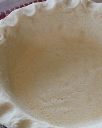 Close up of gluten-free pie crust in a pie tin